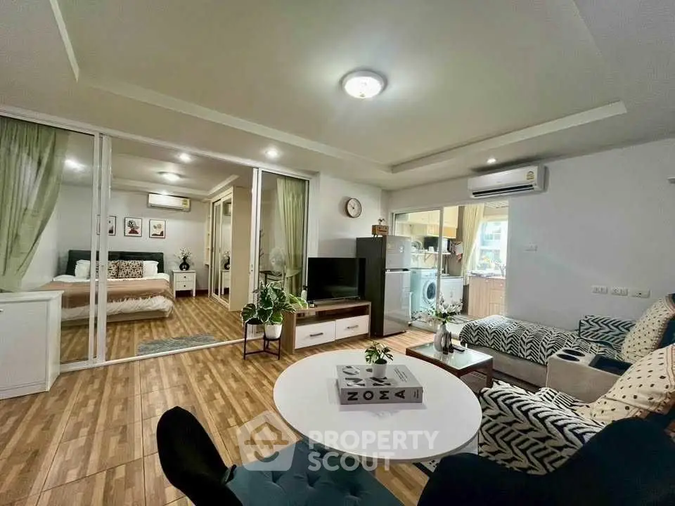 Stylish open-plan living room with modern decor and cozy ambiance