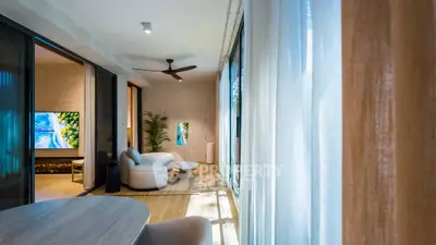Luxurious modern living room with floor-to-ceiling windows and elegant decor