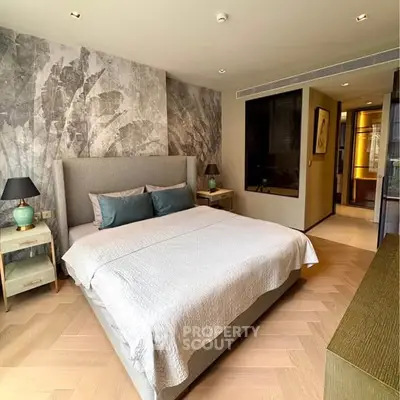 Luxurious bedroom with elegant decor and modern furnishings in a high-end apartment.