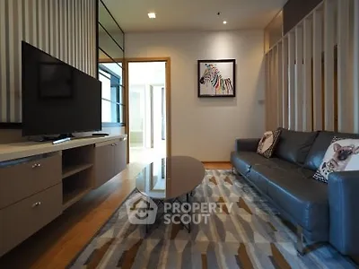 Modern living room with stylish decor and comfortable seating in a contemporary apartment.