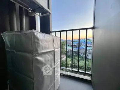 Charming balcony with scenic view of cityscape at sunset, perfect for relaxation and enjoying the outdoors.