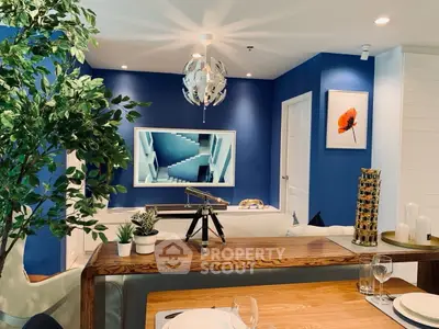 Stylish living room with modern decor and vibrant blue accent wall