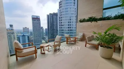 Luxurious high-rise balcony with stunning city skyline view and elegant seating area.