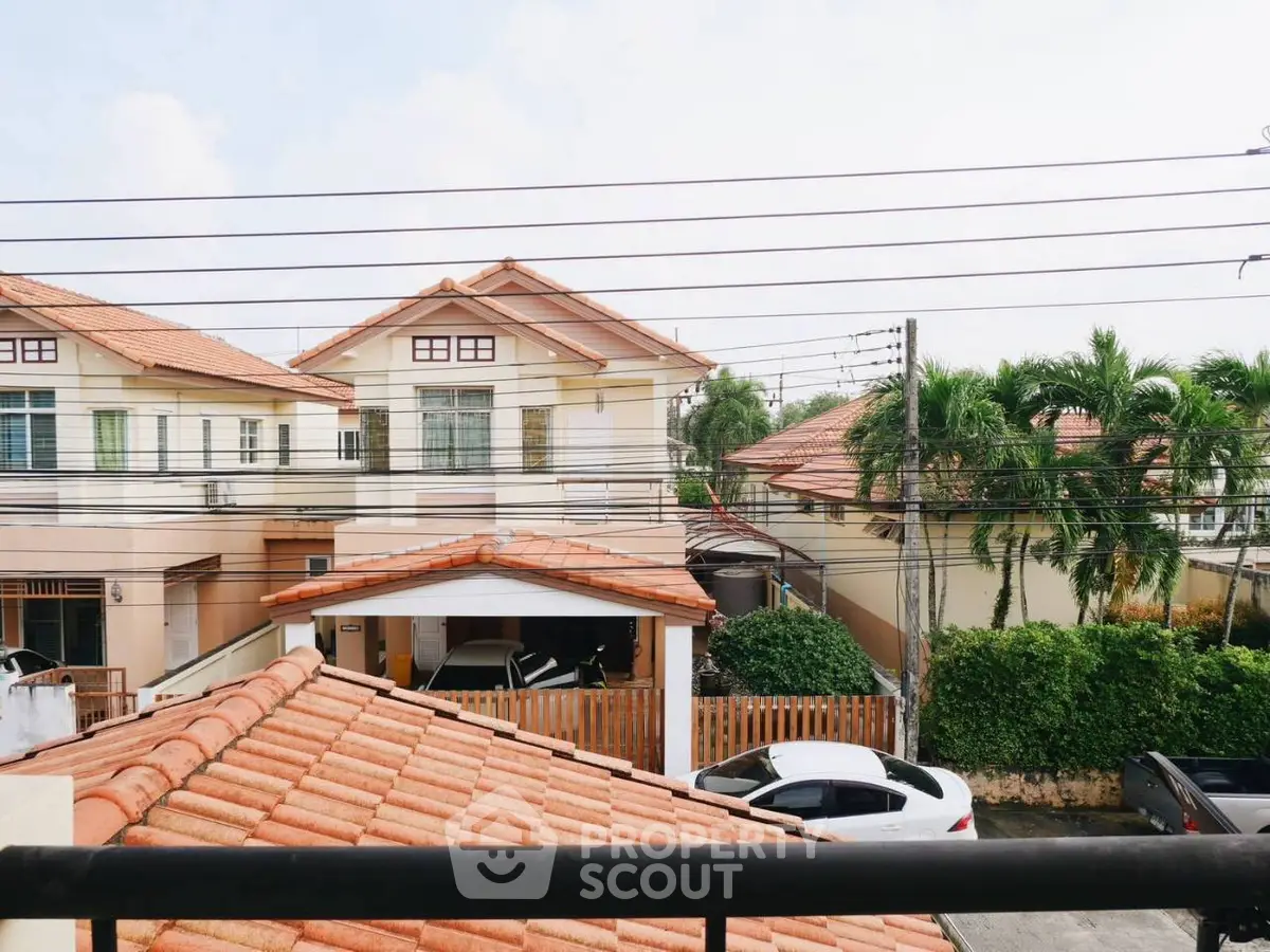 Charming suburban homes with tiled roofs and lush greenery, perfect for family living.