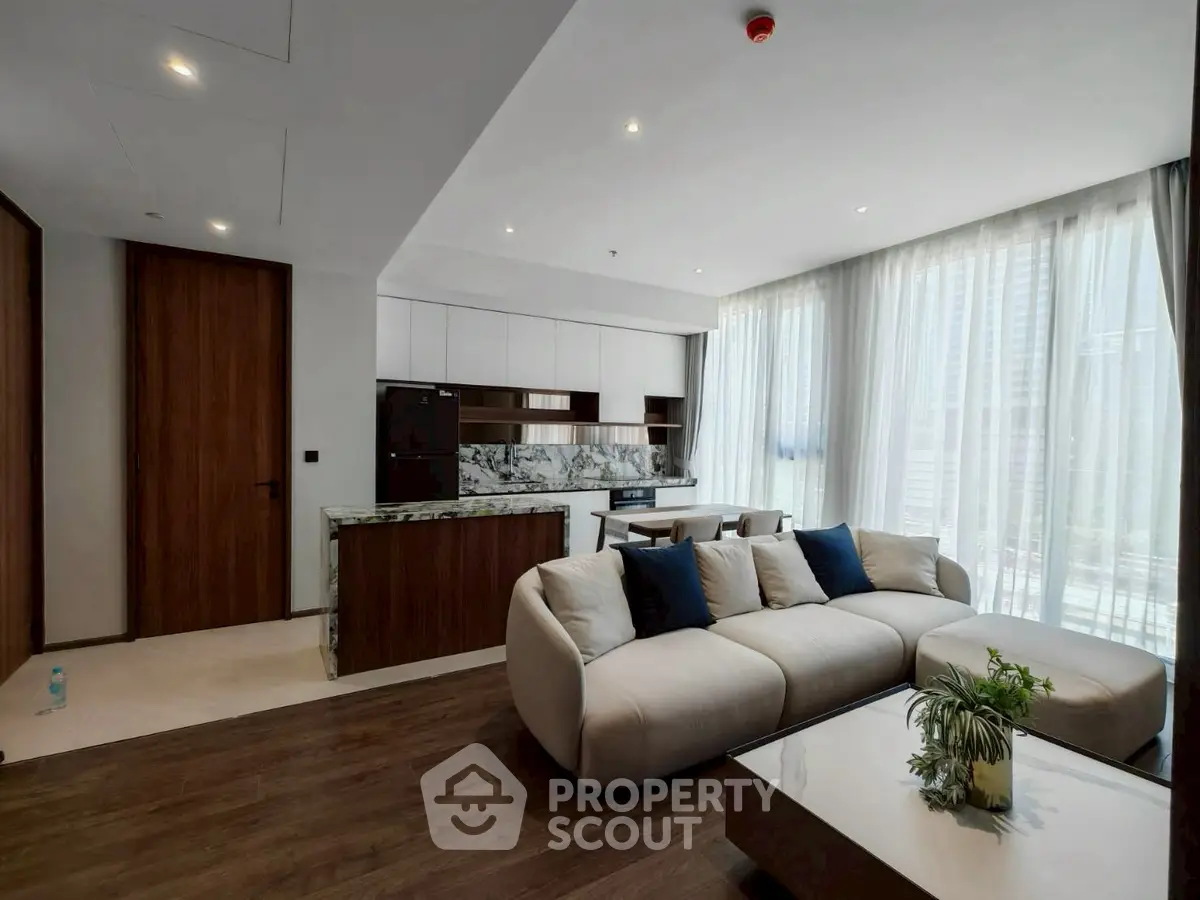 Luxurious modern living room with open kitchen and elegant decor