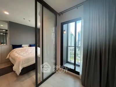 Modern bedroom with balcony and city view in high-rise apartment