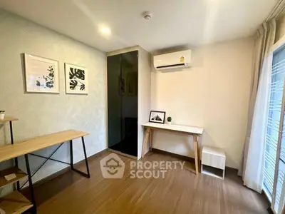 Modern study room with sleek furniture and air conditioning, perfect for productivity and comfort.
