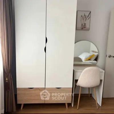 Stylish bedroom with modern wardrobe and elegant vanity set, perfect for contemporary living.