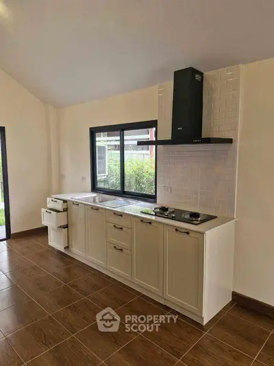 Modern kitchen with sleek cabinets and gas stove in a bright open space