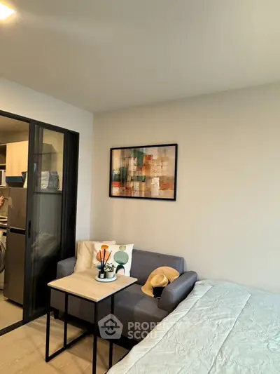 Modern studio apartment with cozy living area and stylish decor