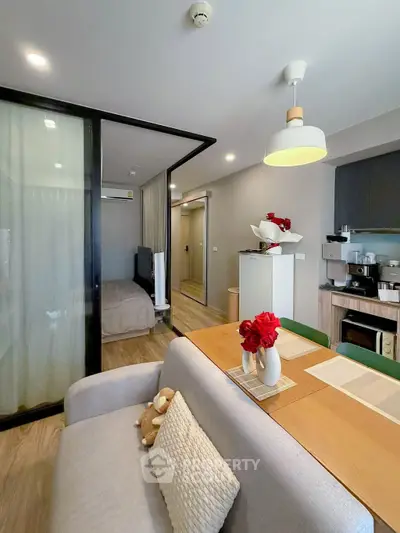 Modern studio apartment with cozy dining area and stylish decor
