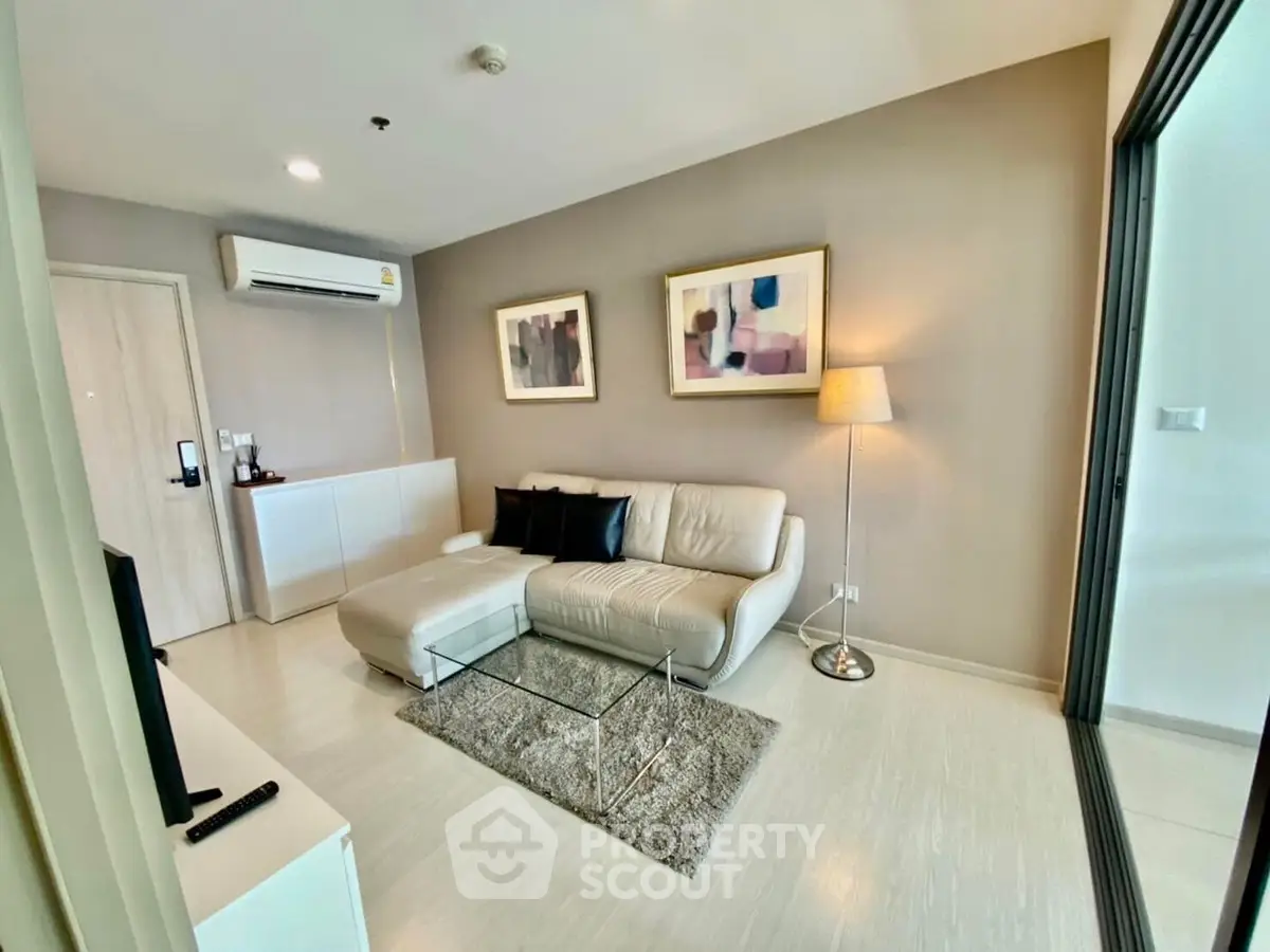 Modern living room with stylish decor and comfortable seating in a contemporary apartment.