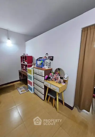 Cozy bedroom with organized storage and vanity setup