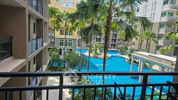 Luxurious apartment view overlooking tropical pool and lush garden
