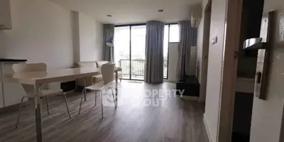 Modern living room with large windows and minimalist furniture