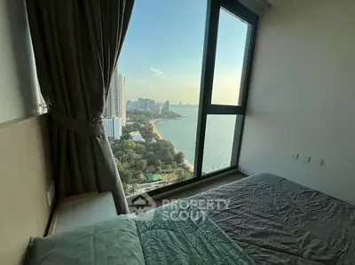 Stunning bedroom with panoramic ocean view in high-rise apartment
