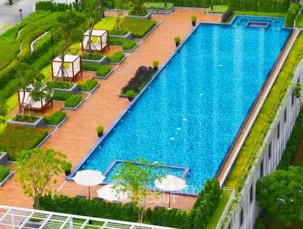 Luxurious rooftop pool with cabanas and lush greenery, perfect for relaxation and leisure.