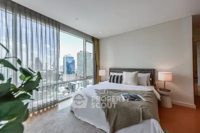 Luxurious bedroom with stunning city view and elegant decor