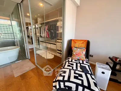 Luxurious bedroom with walk-in closet and stylish decor in modern apartment