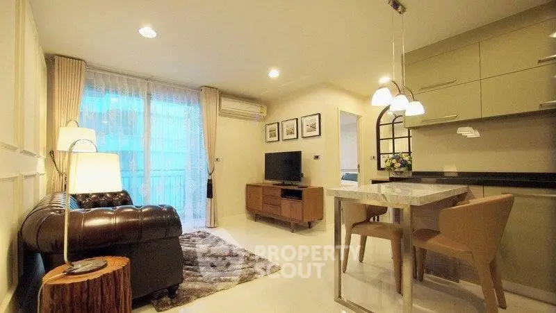 Modern living room with stylish decor and open kitchen layout