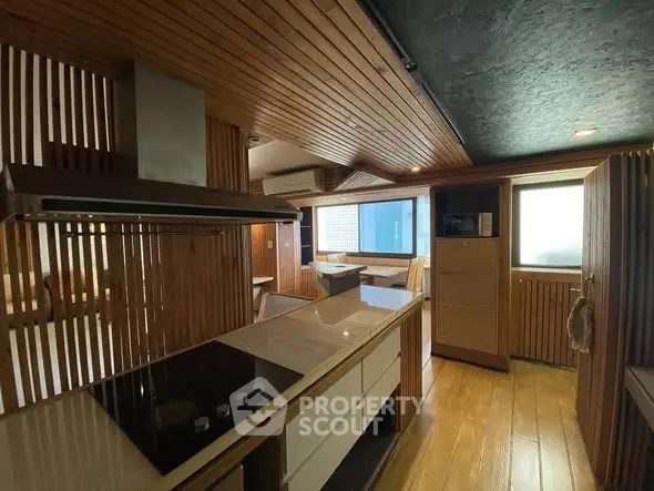 Modern kitchen with sleek wooden design and built-in appliances