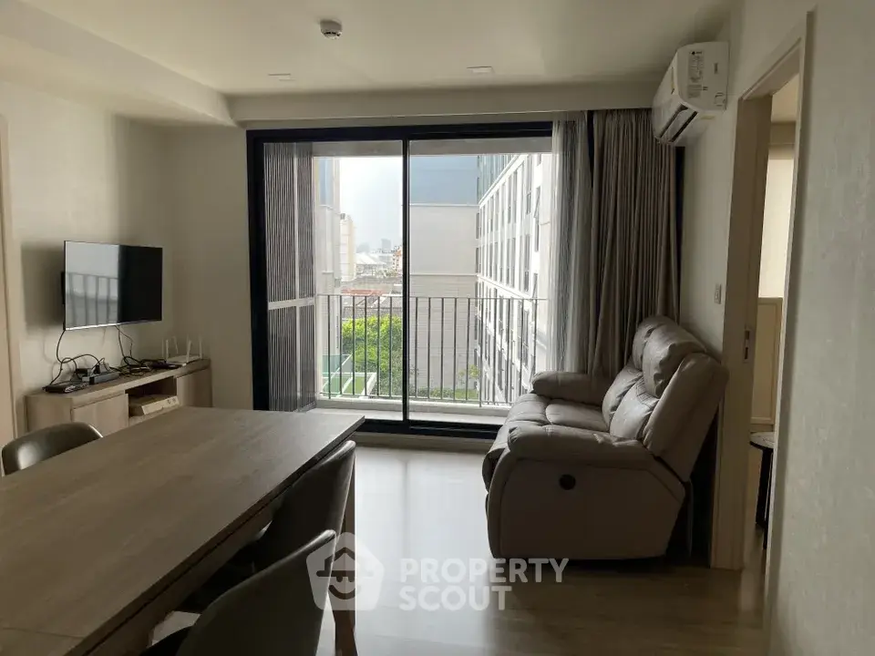Modern living room with balcony view in a stylish apartment
