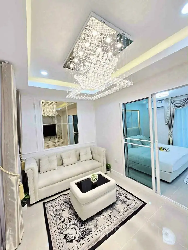 Luxurious living room with elegant chandelier and modern decor