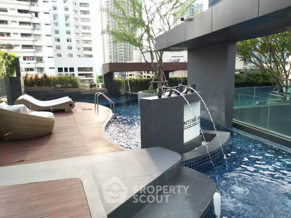 Luxurious rooftop pool with modern design and city views, perfect for relaxation and leisure.