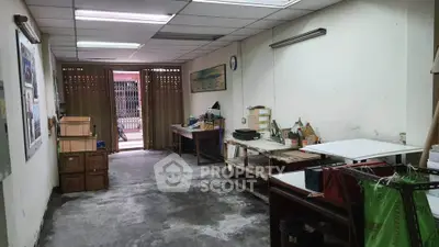 Spacious storage room with ample shelving and natural light, ideal for organizing and storing items efficiently.