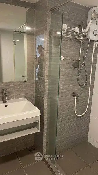 Modern bathroom with sleek shower and contemporary sink design
