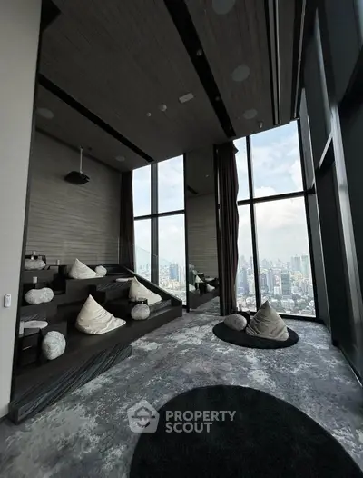 Luxurious high-rise lounge with panoramic city views and modern seating.