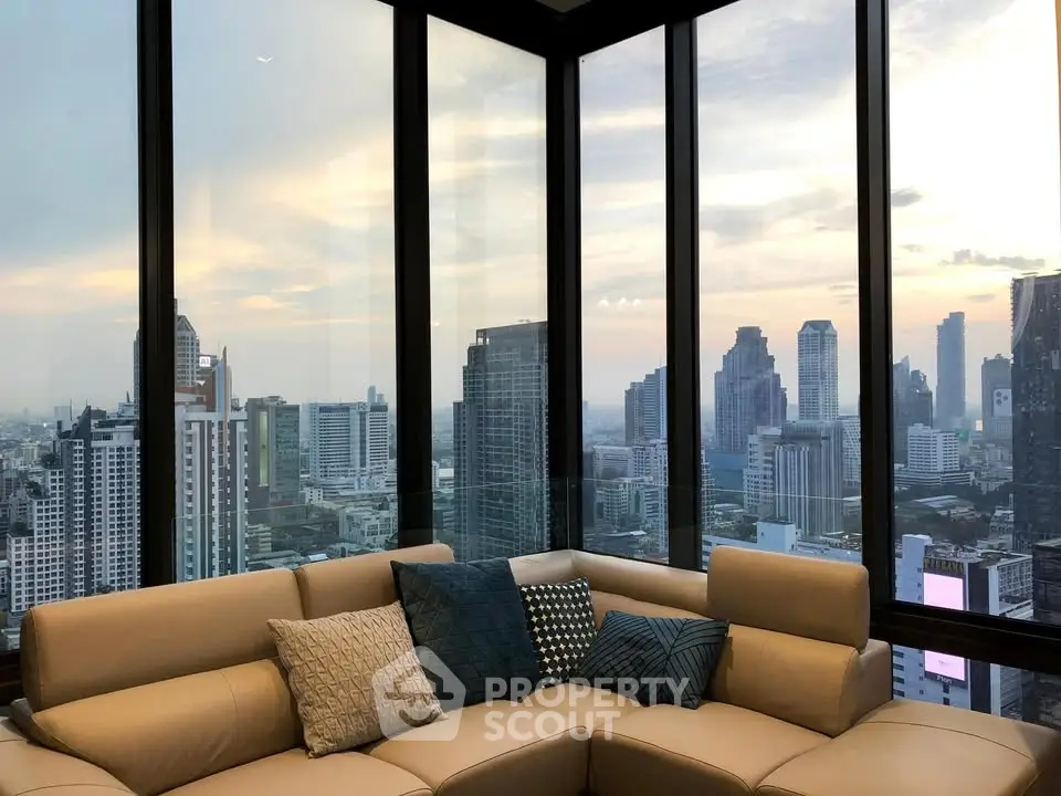 Luxurious corner unit with panoramic city view and stylish living room.
