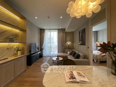 Luxurious open-plan living room with elegant decor and modern kitchen, featuring a cozy seating area and natural light.