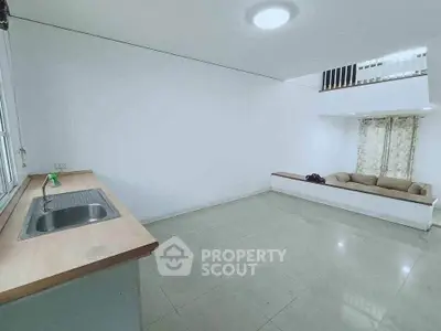 Spacious modern living area with minimalist design and open layout