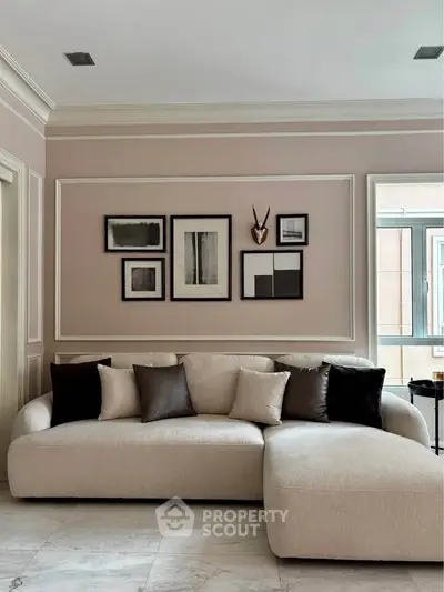 Elegant living room with plush sectional sofa and modern art decor