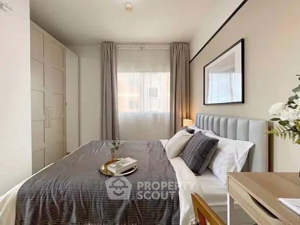 Cozy and stylish bedroom with modern decor and ample natural light.