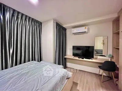 Modern bedroom with sleek design, featuring a wall-mounted TV, air conditioning, and stylish curtains.