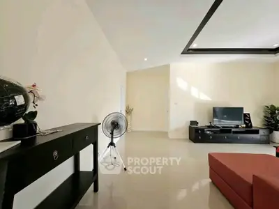 Spacious living room with modern decor and sleek furniture