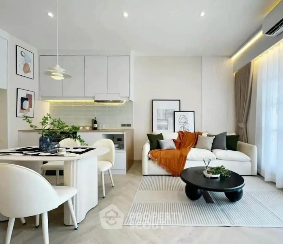 Modern living room with stylish decor and open kitchen layout