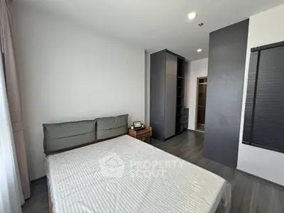 Modern bedroom with sleek design and ample storage space
