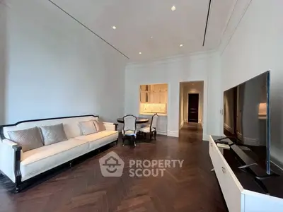 Elegant living room with dark wood flooring and modern furniture