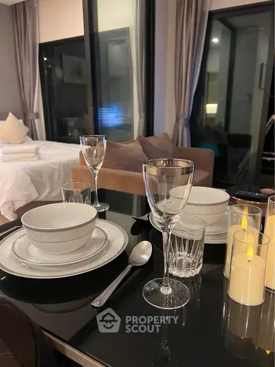 Elegant dining setup in modern living room with cozy ambiance