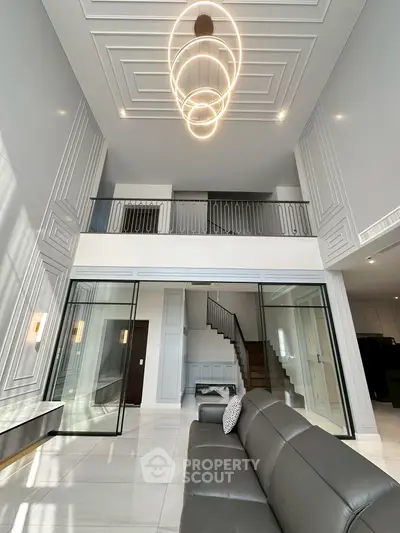 Luxurious modern living room with high ceilings and elegant lighting