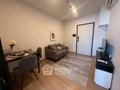 Modern living room with cozy sofa and dining area in stylish apartment