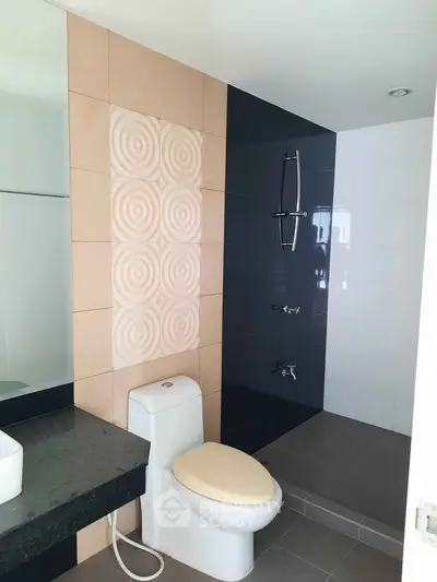 Modern bathroom with stylish tile design and sleek fixtures