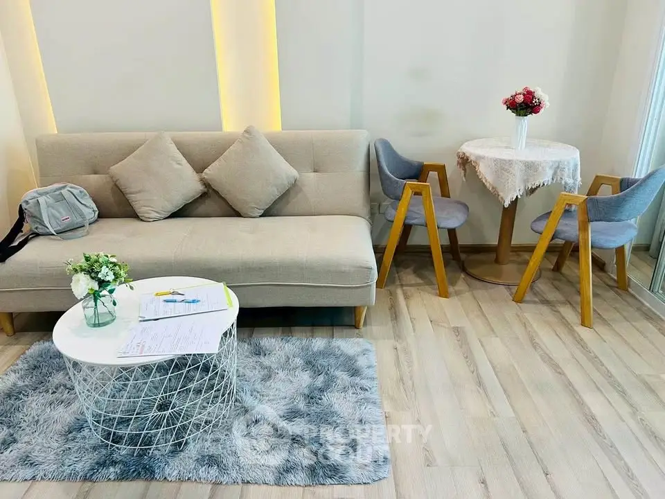 Chic living room with modern furniture and cozy decor in a stylish apartment.