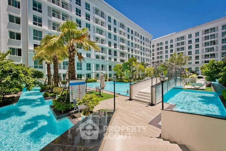 Luxurious condominium with stunning pool and lush garden view