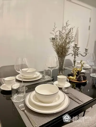 Elegant dining table setup with modern decor and stylish tableware