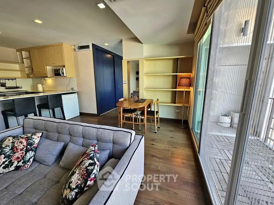 Stylish open-plan living room with modern kitchen and cozy dining area