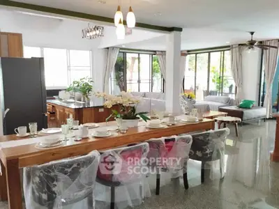 Spacious open-plan living and dining area with modern decor and natural light.